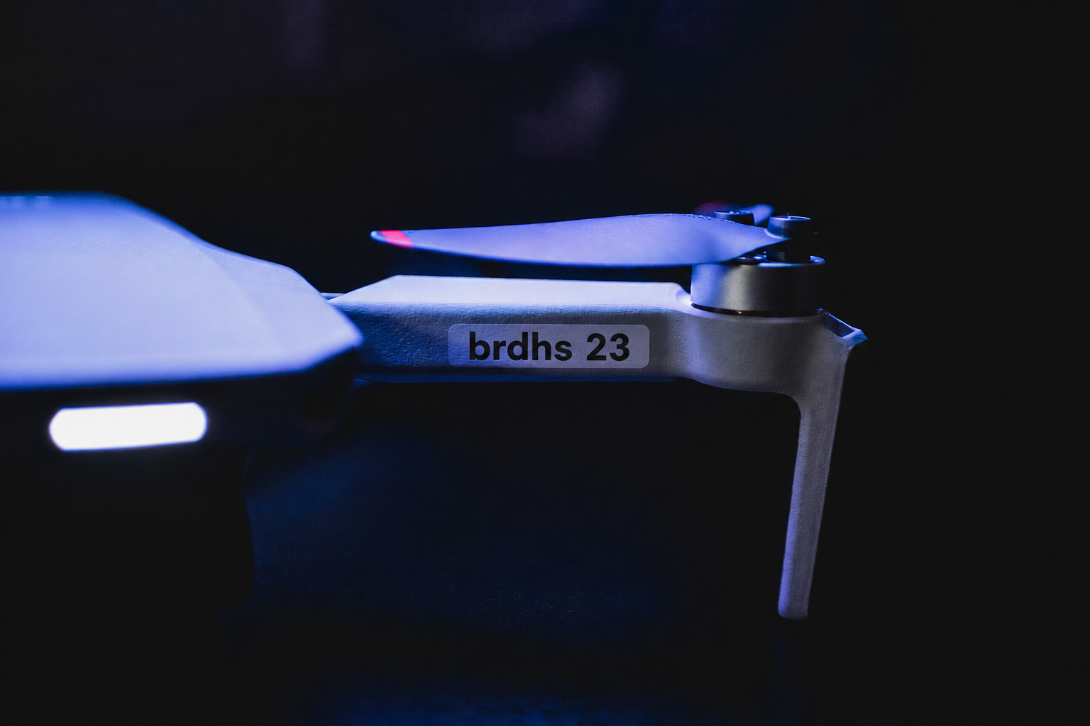 Quadcopter drone in flight carrying a sensor payload